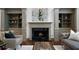 Elegant living room featuring a marble fireplace and custom built-in shelving at 4015 Brookhollow Dr, Douglasville, GA 30135