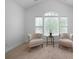 Cozy living room featuring plush seating and a window letting in natural light at 4015 Brookhollow Dr, Douglasville, GA 30135