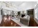 Bright living room boasts high ceilings, hardwood floors, fireplace, and open layout at 4015 Brookhollow Dr, Douglasville, GA 30135