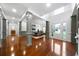 Open-concept living space with hardwood floors, neutral walls, and many windows at 4015 Brookhollow Dr, Douglasville, GA 30135