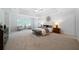 Spacious main bedroom showcases a trey ceiling, neutral colors, and a sitting area at 4015 Brookhollow Dr, Douglasville, GA 30135