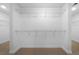 Walk-in closet featuring ample shelving and carpeted flooring at 4015 Brookhollow Dr, Douglasville, GA 30135