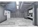 Spacious finished basement features white cabinets and gray wood-look flooring at 417 Wood Branch St, Woodstock, GA 30188