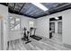 Finished basement features fitness equipment and two windows for natural light at 417 Wood Branch St, Woodstock, GA 30188