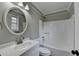 Bathroom featuring a vanity, mirror, toilet and shower/tub combo with neutral color palette at 417 Wood Branch St, Woodstock, GA 30188