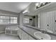 This home's bathroom features a soaking tub, double sinks, and a neutral color palette at 417 Wood Branch St, Woodstock, GA 30188