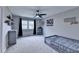 This bedroom features a grey color palette, ceiling fan, and superhero themed wall art at 417 Wood Branch St, Woodstock, GA 30188