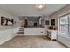 Light filled dining area showcases staircase to living room, decor and large windows at 417 Wood Branch St, Woodstock, GA 30188