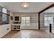 Bright dining area features a side board, staircase view, and large windows providing natural light at 417 Wood Branch St, Woodstock, GA 30188