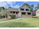 Inviting two-story home with a covered porch and mature landscaping at 417 Wood Branch St, Woodstock, GA 30188