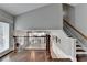 Foyer with hardwood floors, view into living room, and staircase at 417 Wood Branch St, Woodstock, GA 30188