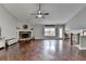 Spacious living room features a stone fireplace, hardwood floors, and a ceiling fan at 417 Wood Branch St, Woodstock, GA 30188