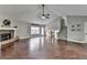 Bright living room features a stone fireplace, hardwood floors, and a staircase at 417 Wood Branch St, Woodstock, GA 30188
