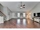 Bright living room features hardwood floors, neutral walls, and a ceiling fan at 417 Wood Branch St, Woodstock, GA 30188