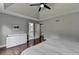 This main bedroom features tray ceilings, dark hardwood floors, and a connected bathroom and walk-in closet at 417 Wood Branch St, Woodstock, GA 30188