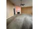 Spacious living room with a fireplace and neutral color scheme, awaiting personal touches at 4401 Chestnut Lake Ave, Lithonia, GA 30038