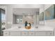Bathroom boasts double sinks with sleek hardware and a large, frameless mirror at 4958 Jatoba Rd, Acworth, GA 30101