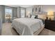 Comfortable bedroom featuring plush carpet, ample natural light, and tasteful decor for a relaxing retreat at 4958 Jatoba Rd, Acworth, GA 30101
