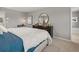 Bedroom offers light grey walls and modern furniture with views leading to the ensuite bathroom space at 4958 Jatoba Rd, Acworth, GA 30101