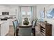 Open floor plan connecting dining area to kitchen with modern finishes at 4958 Jatoba Rd, Acworth, GA 30101