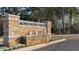 Stone monument sign welcomes residents to Rosewood Farms at 4958 Jatoba Rd, Acworth, GA 30101