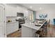 Bright kitchen features granite counters, white cabinetry, stainless steel appliances at 4958 Jatoba Rd, Acworth, GA 30101