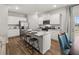 Bright kitchen features granite counters, white cabinetry, stainless steel appliances at 4958 Jatoba Rd, Acworth, GA 30101