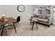 Open living room features modern decor, comfortable seating, and a work desk at 4958 Jatoba Rd, Acworth, GA 30101