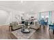 Bright living area with hardwood flooring, stylish furniture, and direct access to the kitchen and dining at 4958 Jatoba Rd, Acworth, GA 30101