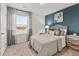 Serene main bedroom featuring large window, an accent wall, and comfortable furnishings at 4958 Jatoba Rd, Acworth, GA 30101