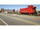 Street view highlighting the historic Acworth train car and pedestrian bridge for community engagement at 4958 Jatoba Rd, Acworth, GA 30101