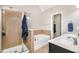 Bathroom featuring a walk-in shower, soaking tub, and double sink vanity at 7620 Stoneridge Dr, Atlanta, GA 30328