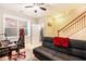 Bedroom with an office setup, a comfortable futon, and stairs at 7620 Stoneridge Dr, Atlanta, GA 30328