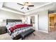 Bedroom with a comfortable bed, a sitting bench, and an ensuite bathroom at 7620 Stoneridge Dr, Atlanta, GA 30328