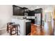 Modern kitchen with stainless steel appliances, granite countertops, and a breakfast bar with seating at 7620 Stoneridge Dr, Atlanta, GA 30328