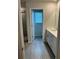 Bright bathroom featuring modern fixtures, tile flooring and a shower at 950 Sunny Lake Dr, Lawrenceville, GA 30043