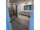 Modern bathroom featuring a glass shower, dual vanity, and tile flooring at 950 Sunny Lake Dr, Lawrenceville, GA 30043