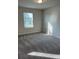 Bright bedroom featuring neutral walls, plush carpet and a window offering plenty of natural light at 950 Sunny Lake Dr, Lawrenceville, GA 30043