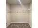 Open closet with metal shelves, providing plenty of storage space at 950 Sunny Lake Dr, Lawrenceville, GA 30043