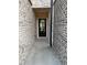 Charming entrance featuring a brick-lined walkway leading to a glass-paneled front door at 950 Sunny Lake Dr, Lawrenceville, GA 30043