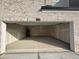 Spacious two car garage with high ceilings providing ample room for storage and parking at 950 Sunny Lake Dr, Lawrenceville, GA 30043