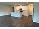 Open-concept kitchen with white cabinets, stainless steel appliances, and a large island at 950 Sunny Lake Dr, Lawrenceville, GA 30043