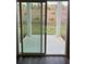 Covered patio provides an outdoor extension with views of landscaped yard for relaxing or entertaining at 950 Sunny Lake Dr, Lawrenceville, GA 30043