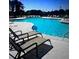 Relaxing community pool with plenty of lounge chairs to enjoy a sunny day at 950 Sunny Lake Dr, Lawrenceville, GA 30043