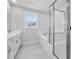 Modern bathroom featuring a large soaking tub and separate glass-enclosed shower at 2540 Silver Star Ne Dr, Marietta, GA 30066