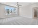 Bright bedroom with carpet flooring and large windows with tree views at 2540 Silver Star Ne Dr, Marietta, GA 30066