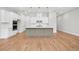 Bright kitchen with stainless steel appliances, white cabinets and a large gray kitchen island at 2540 Silver Star Ne Dr, Marietta, GA 30066