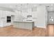 Bright kitchen with stainless steel appliances, white cabinets and a large gray kitchen island at 2540 Silver Star Ne Dr, Marietta, GA 30066