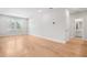 Large living room featuring hardwood floors and a door that leads to a bathroom at 2540 Silver Star Ne Dr, Marietta, GA 30066