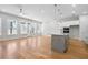 Open concept living room with a view of the kitchen, and an adjacent seating area at 2540 Silver Star Ne Dr, Marietta, GA 30066